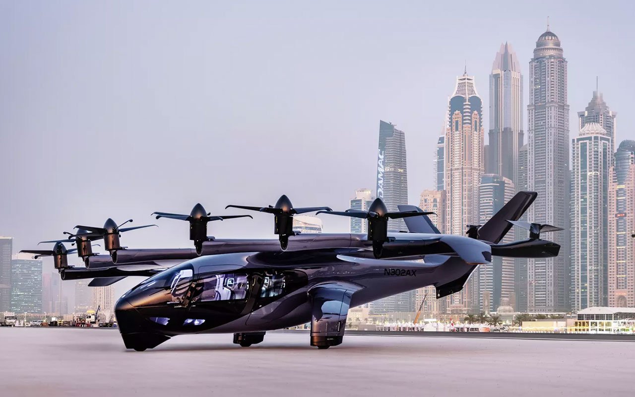 Archer Midnight eVTOL landed on a designated urban takeoff pad with a bustling cityscape in the background, showcasing its potential for seamless integration into urban transportation.