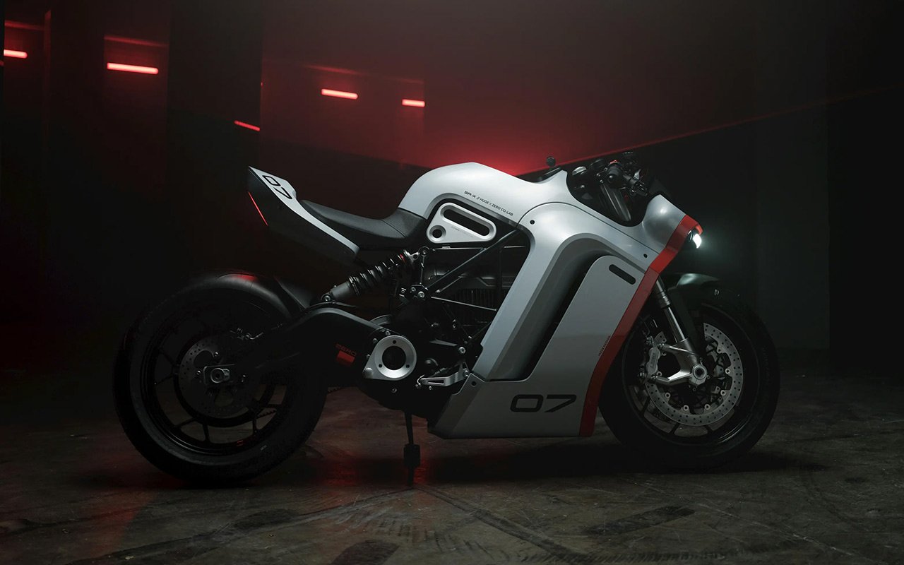 Side view of the ZERO SR-X Concept electric motorcycle, showcasing its sleek, modern design with exposed electric motor and a futuristic aesthetic.